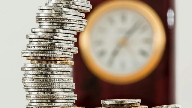 Financial meeting - antique clock symbolizing timeless investment wisdom