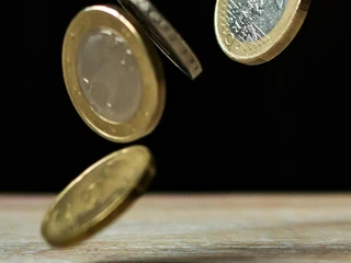 Stack of coins representing financial growth and regulatory changes